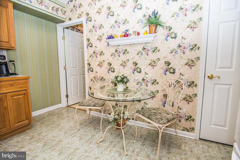 217 Windjammer Road Ocean Pines, MD 21811 - Photo 30 of 47 a view of wooden door and chair in the bathroom