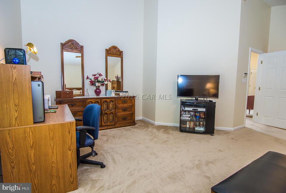 217 Windjammer Road Ocean Pines, MD 21811 - Photo 37 of 47 a view of a workspace with furniture and a flat screen tv