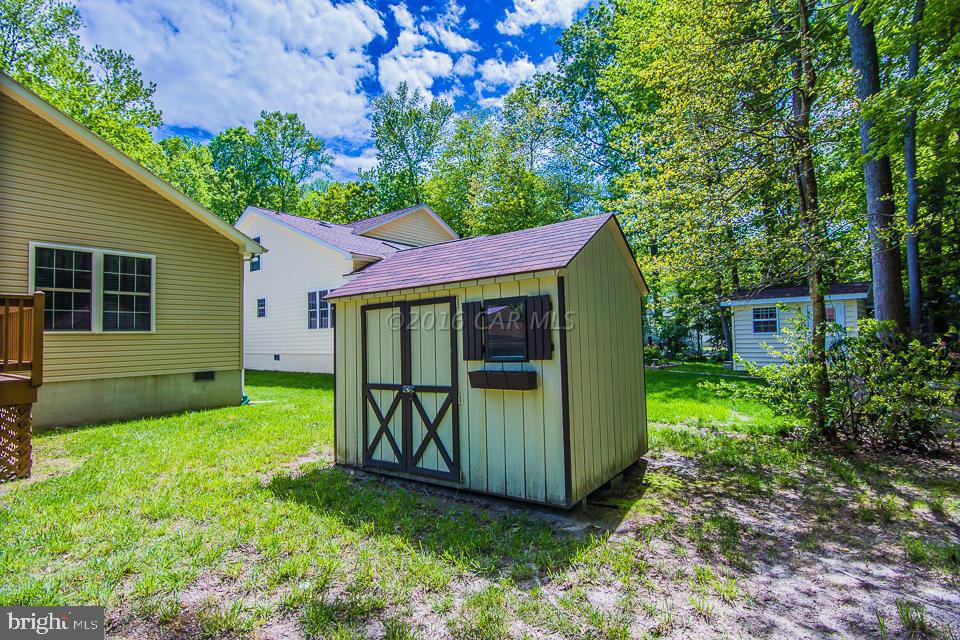 217 Windjammer Road Ocean Pines, MD 21811 - Photo 41 of 47 a view of a backyard with a garden