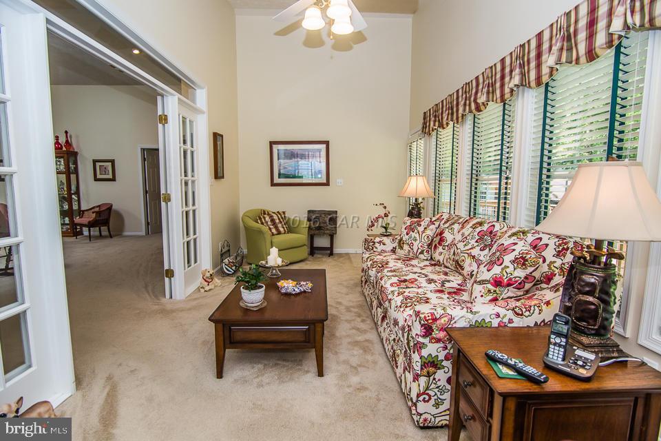 217 Windjammer Road Ocean Pines, MD 21811 - Photo 45 of 47 a bedroom with furniture and a chandelier
