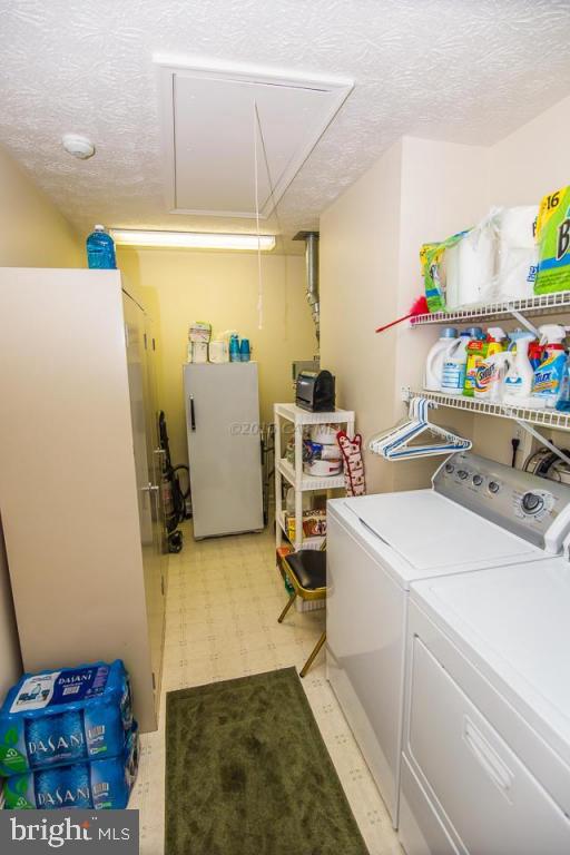 217 Windjammer Road Ocean Pines, MD 21811 - Photo 46 of 47 a storage room with washer and dryer