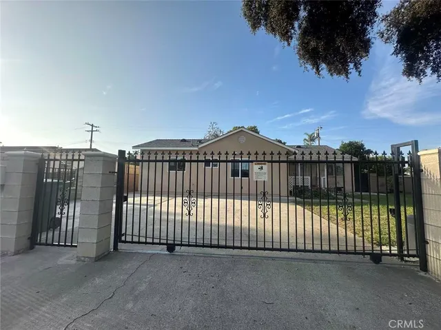a view of a wrought iron fences in front of house
