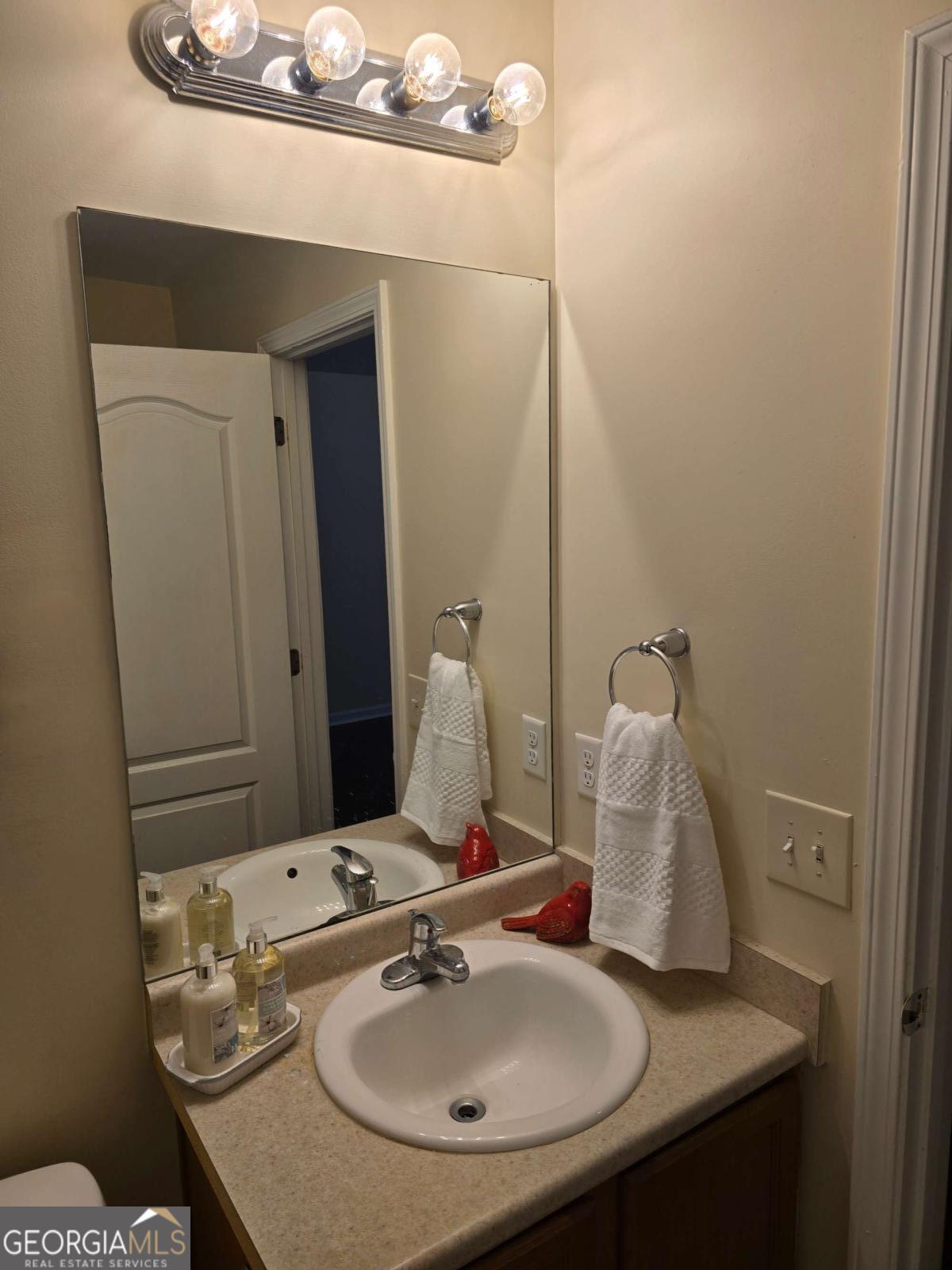 13 Rice Mill Road Port Wentworth, GA 31407 - Photo 11 of 21 a bathroom with a sink and a mirror