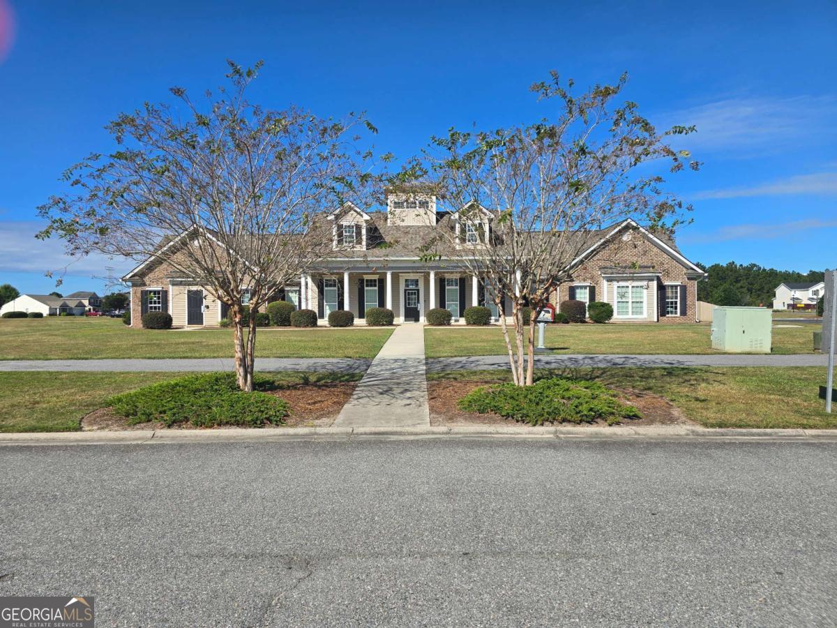 13 Rice Mill Road Port Wentworth, GA 31407 - Photo 18 of 21 a front view of a house with a yard