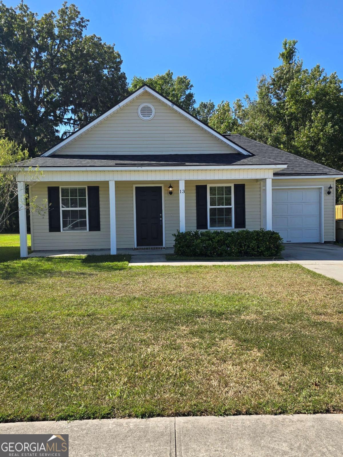 13 Rice Mill Road Port Wentworth, GA 31407 - Photo 2 of 21 a front view of a house with garden