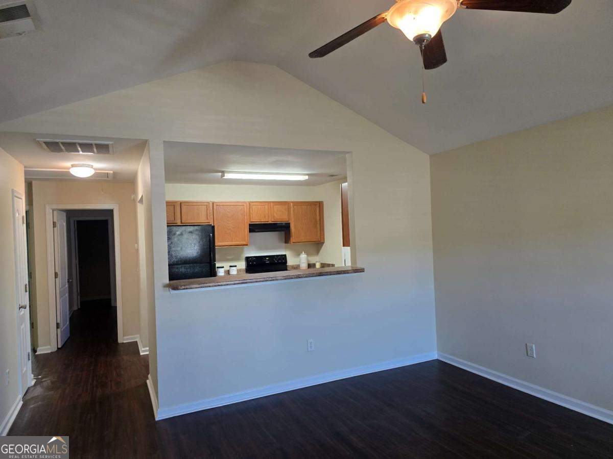 13 Rice Mill Road Port Wentworth, GA 31407 - Photo 4 of 21 a view of a room with wooden floor and chandelier