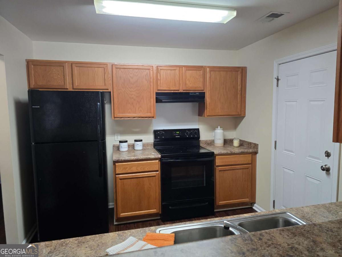 13 Rice Mill Road Port Wentworth, GA 31407 - Photo 5 of 21 a kitchen with stainless steel appliances granite countertop a refrigerator and a stove