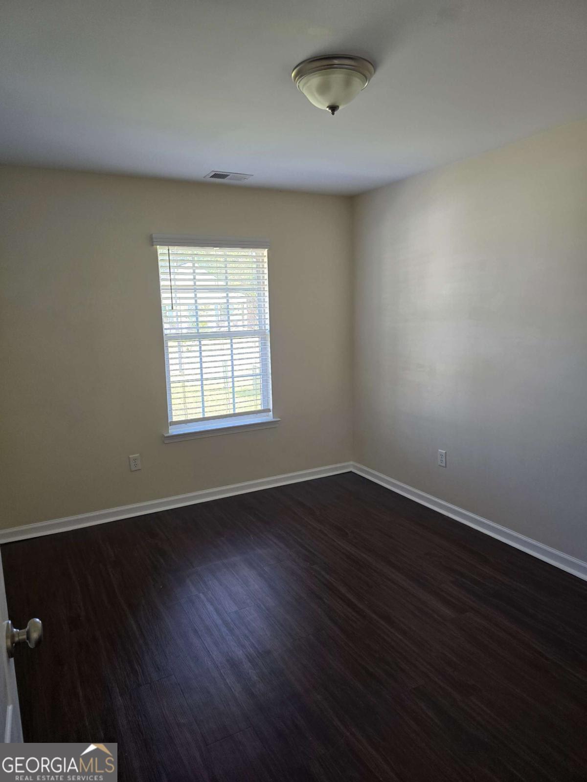 13 Rice Mill Road Port Wentworth, GA 31407 - Photo 10 of 21 an empty room with wooden floor and windows