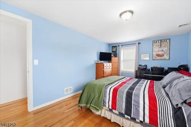 a bed room with a bed and a window