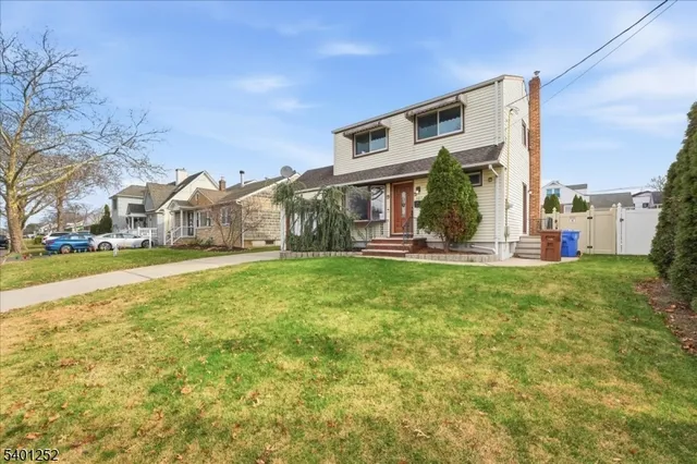 a front view of house with garden