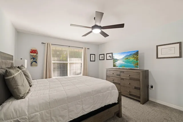 a bedroom with a bed and a dresser