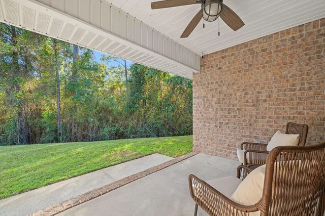 a view of a patio with a yard