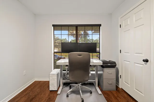 a workspace with furniture and wooden floor