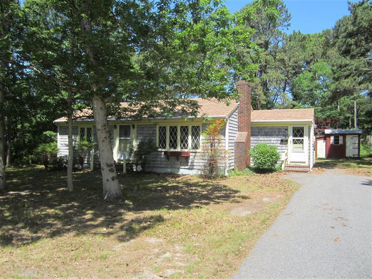 20 Skating Rink Road Hyannis, MA 02601 - Photo 1 of 20 a front view of a house with a yard garage and outdoor seating
