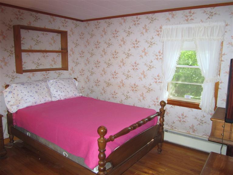 20 Skating Rink Road Hyannis, MA 02601 - Photo 17 of 20 a bed room with a bed and a window
