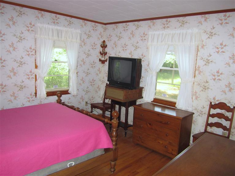 20 Skating Rink Road Hyannis, MA 02601 - Photo 18 of 20 a bedroom with a bed and a window
