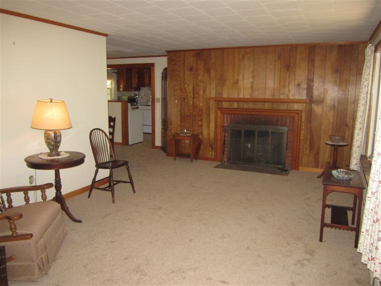 20 Skating Rink Road Hyannis, MA 02601 - Photo 6 of 20 a living room with furniture and a fireplace