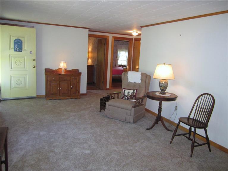 20 Skating Rink Road Hyannis, MA 02601 - Photo 7 of 20 a living room with furniture and a lamp