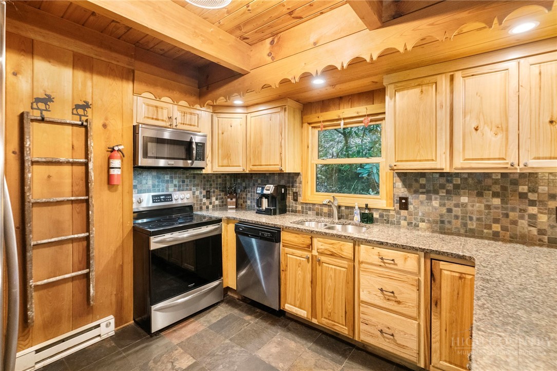 268 Cherry Drive Boone, NC 28607 - Photo 9 of 29 a kitchen with stainless steel appliances a stove sink and microwave