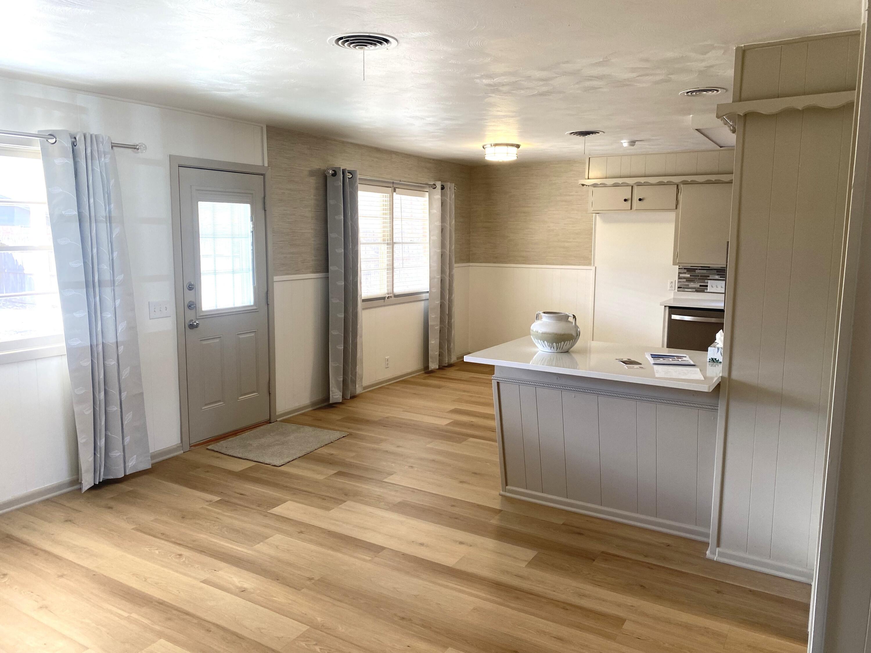 3415 58th Street Lubbock, TX 79413 - Photo 11 of 38 a room with a window and flowerpot