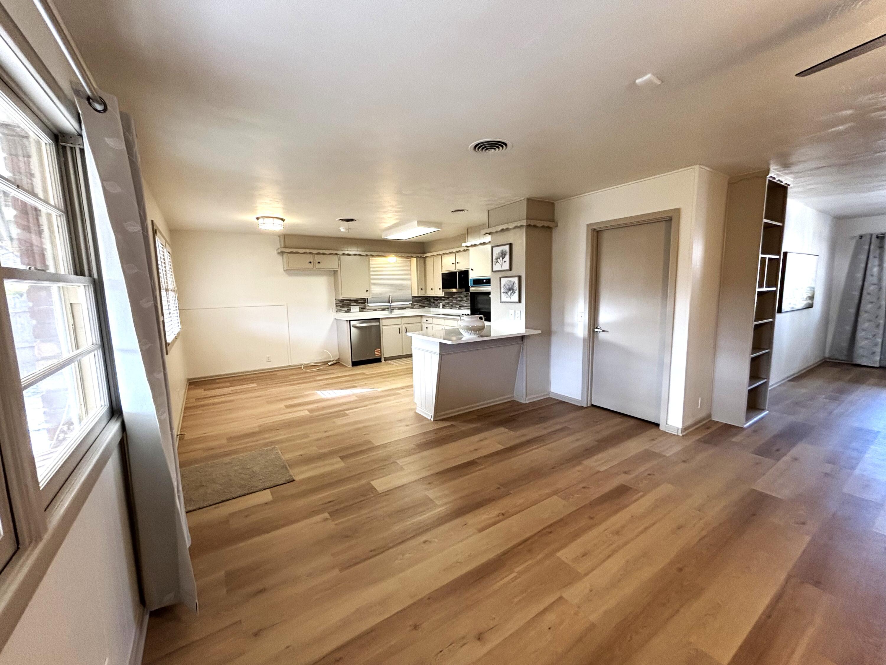 3415 58th Street Lubbock, TX 79413 - Photo 15 of 38 a view of empty room with wooden floor
