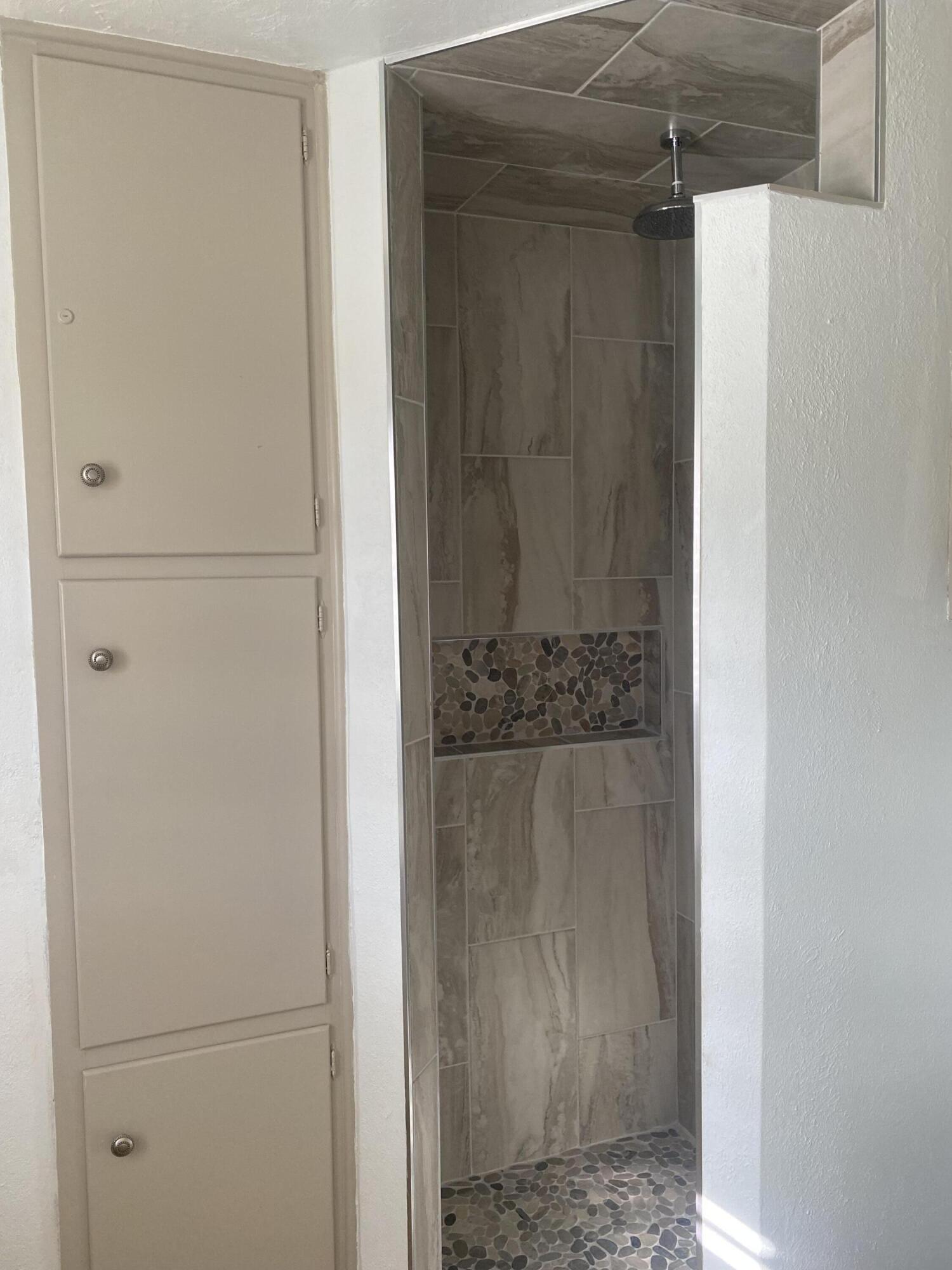 3415 58th Street Lubbock, TX 79413 - Photo 27 of 38 a bathroom with a shower