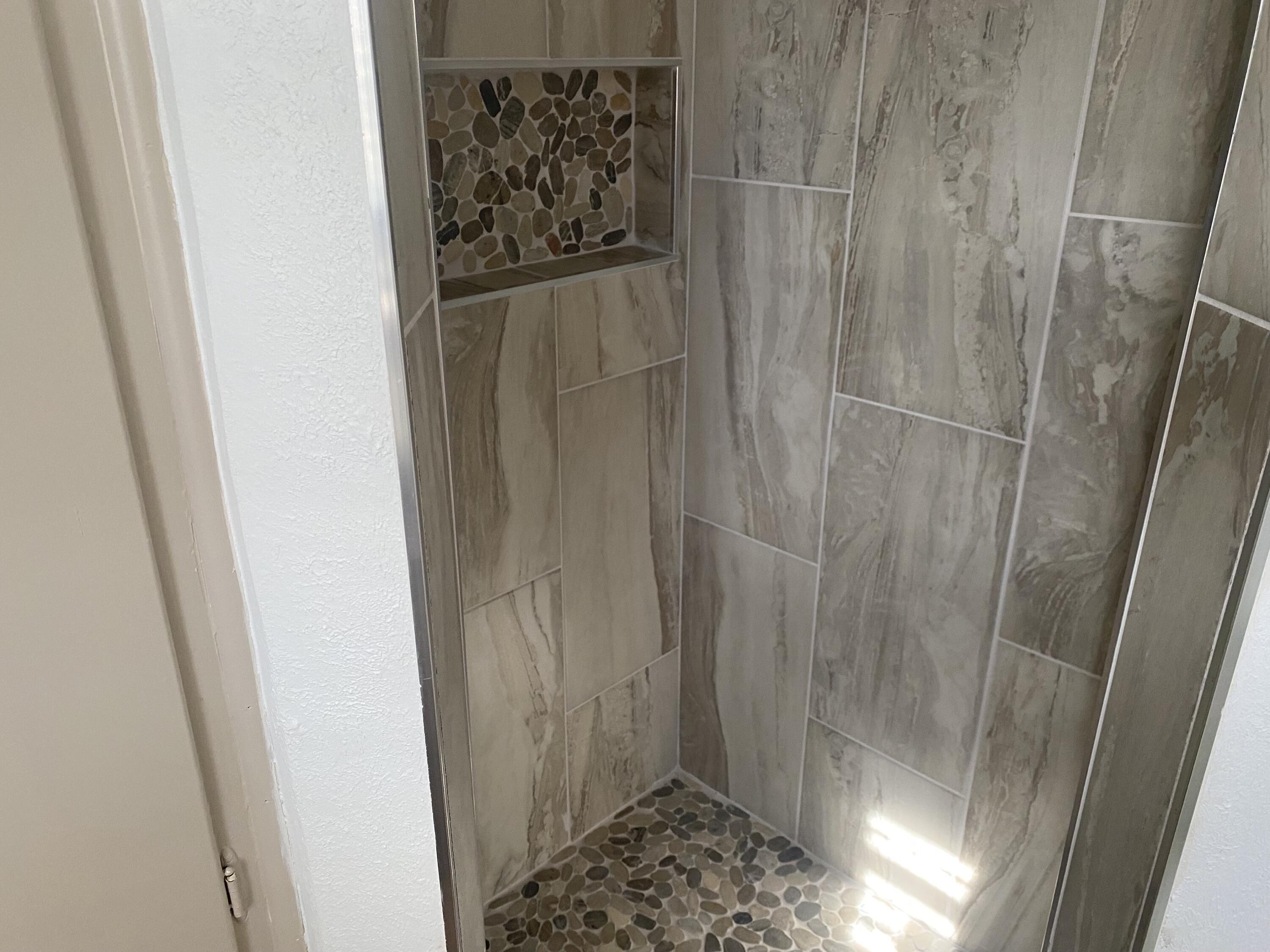 3415 58th Street Lubbock, TX 79413 - Photo 29 of 38 a bathroom with a shower