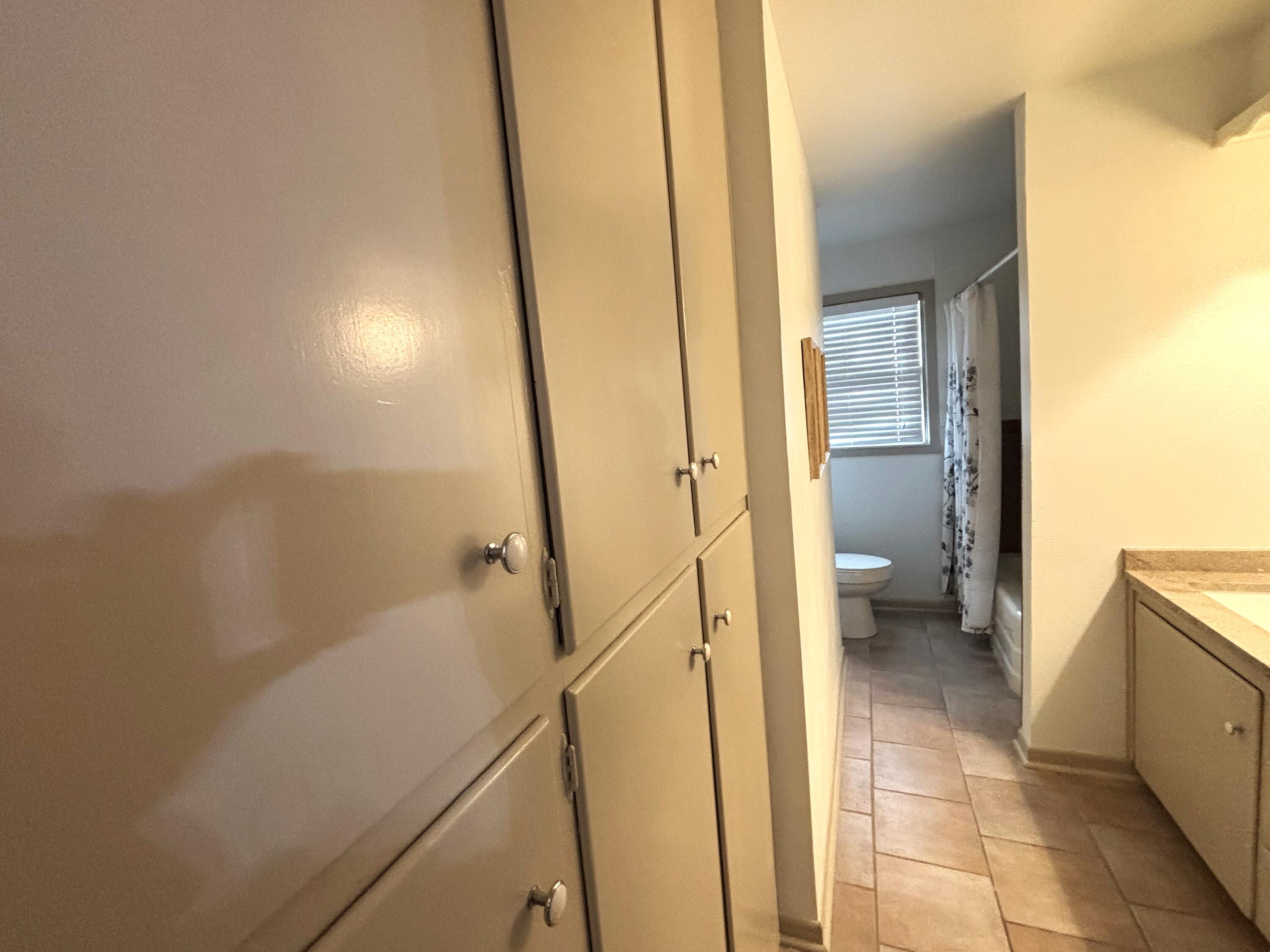 3415 58th Street Lubbock, TX 79413 - Photo 32 of 38 a bathroom with a granite countertop shower and a sink