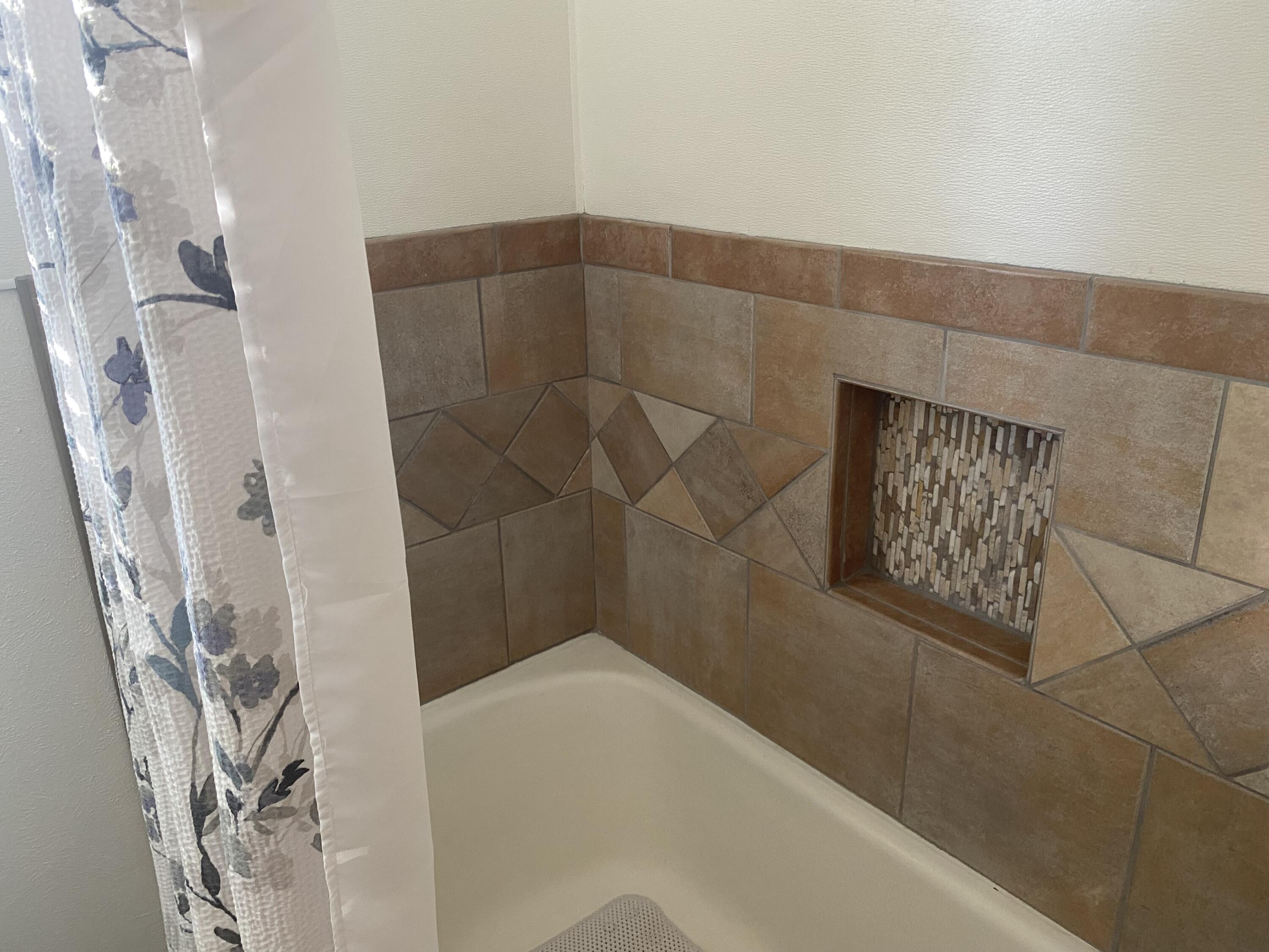 3415 58th Street Lubbock, TX 79413 - Photo 33 of 38 a bathroom with a shower