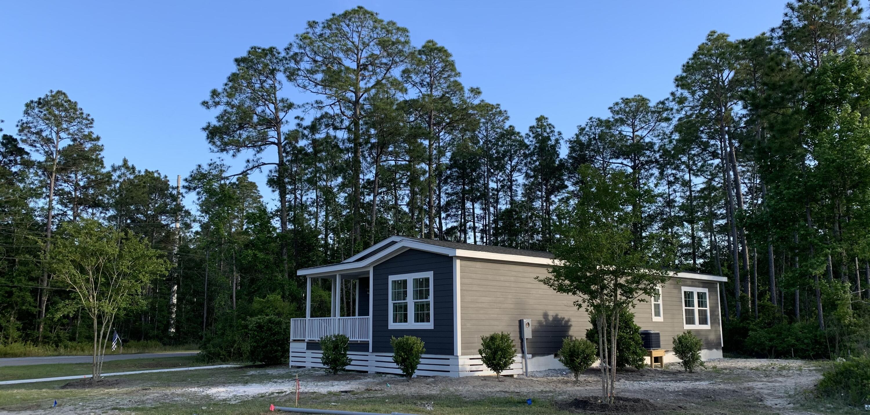 455 North County 395 Santa Rosa Beach, Unit 1 Santa Rosa Beach, FL 32459 - Photo 2 of 13 a front view of a house with a garden