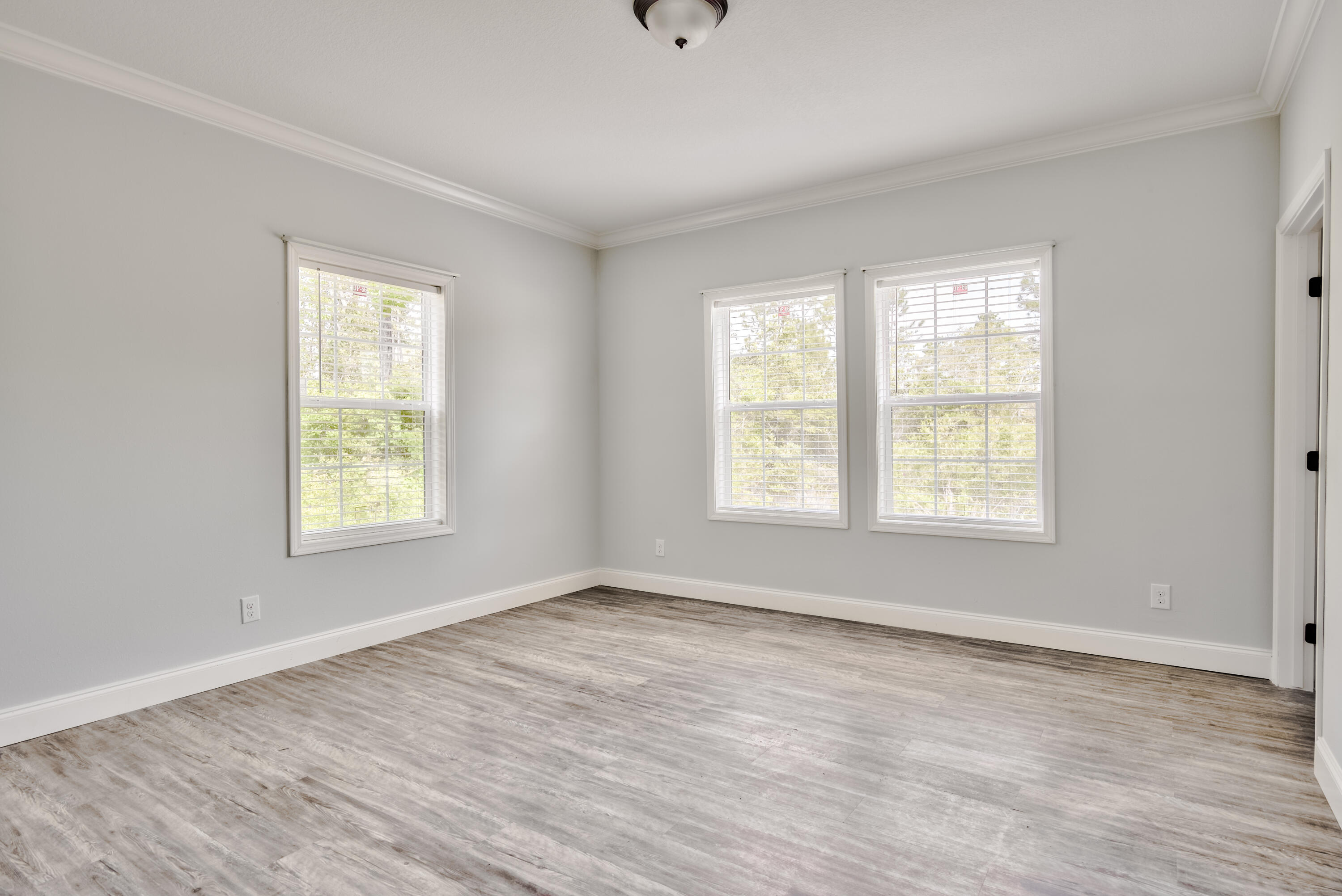 455 North County 395 Santa Rosa Beach, Unit 1 Santa Rosa Beach, FL 32459 - Photo 12 of 13 a view of an empty room with wooden floor and a window