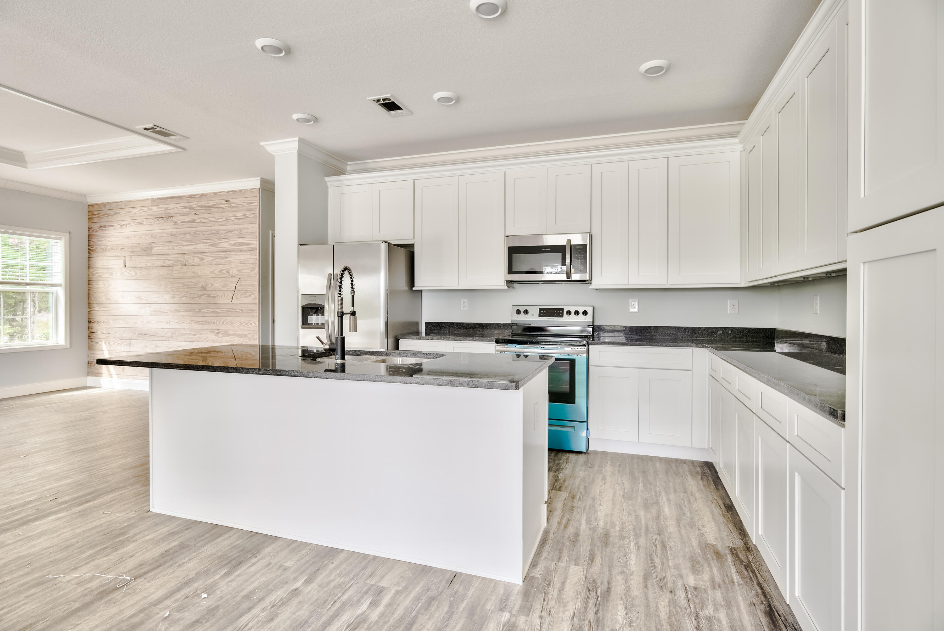 455 North County 395 Santa Rosa Beach, Unit 1 Santa Rosa Beach, FL 32459 - Photo 6 of 13 a kitchen with appliances a sink and cabinets