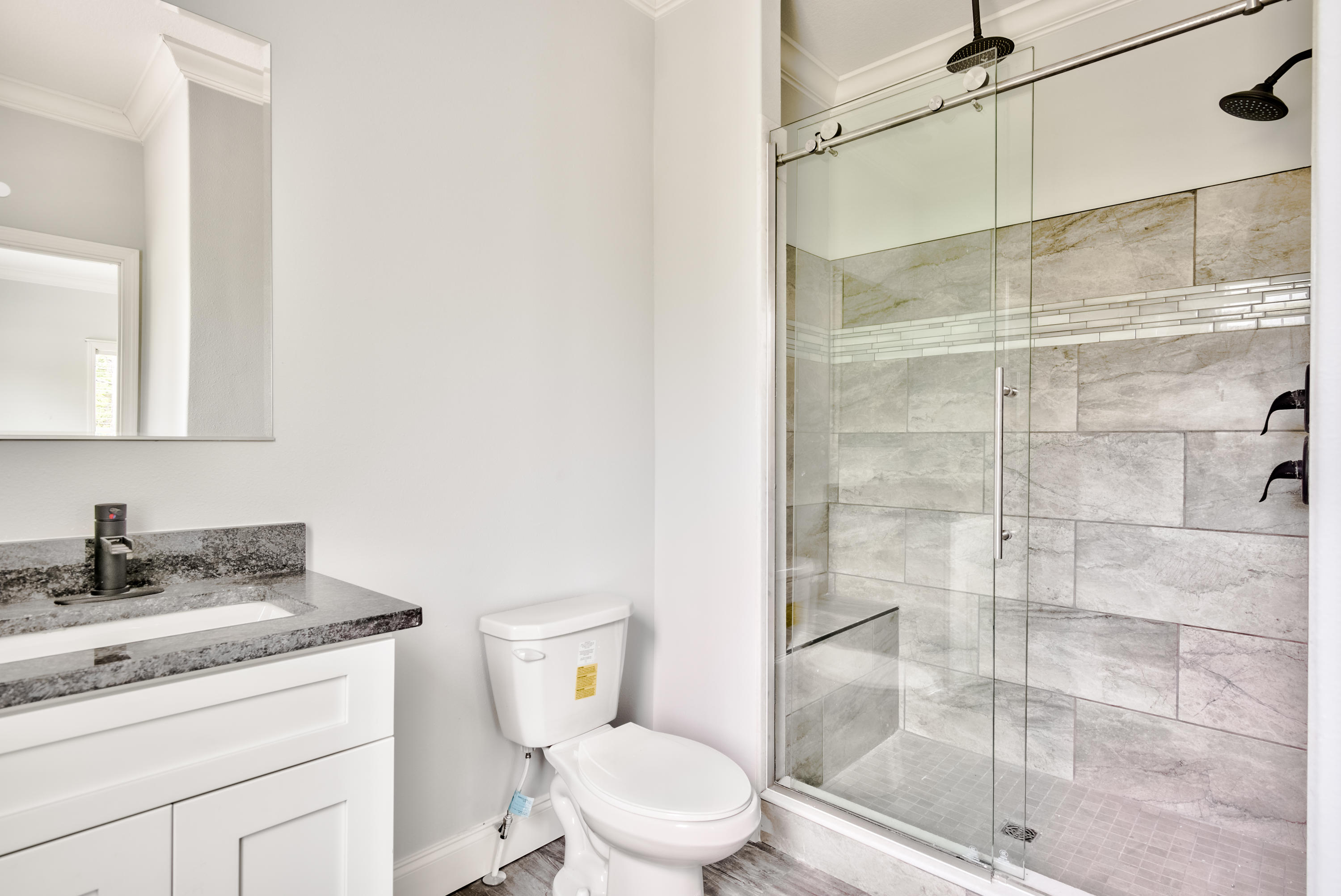 455 North County 395 Santa Rosa Beach, Unit 1 Santa Rosa Beach, FL 32459 - Photo 9 of 13 a bathroom with a granite countertop sink toilet and shower