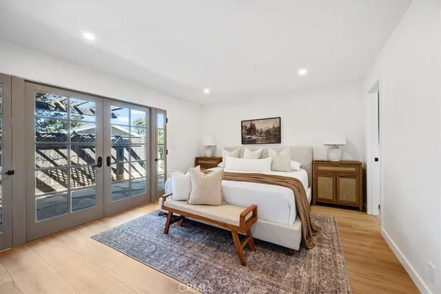 a bed room with a bed and glass door