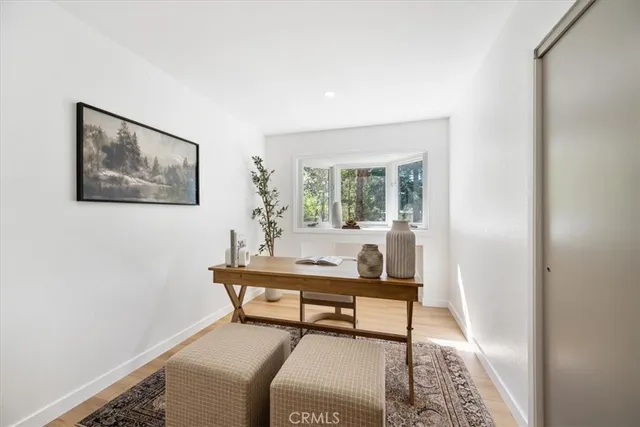 a workspace with furniture and a window