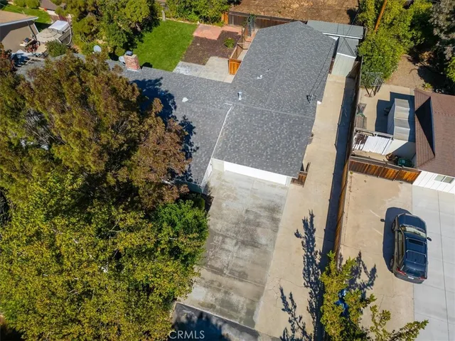 an aerial view of houses with outdoor space