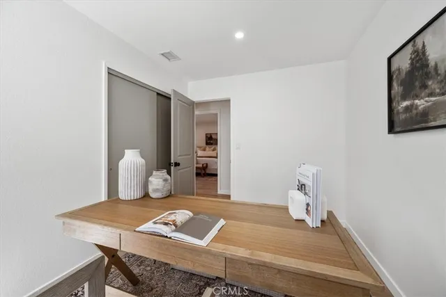 a workspace with furniture and bathroom