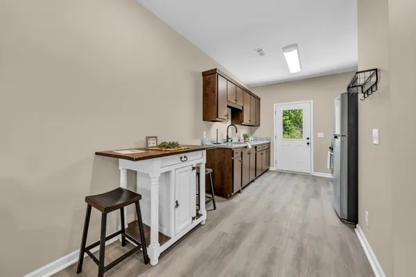 a kitchen with a sink cabinets and stainless steel appliances