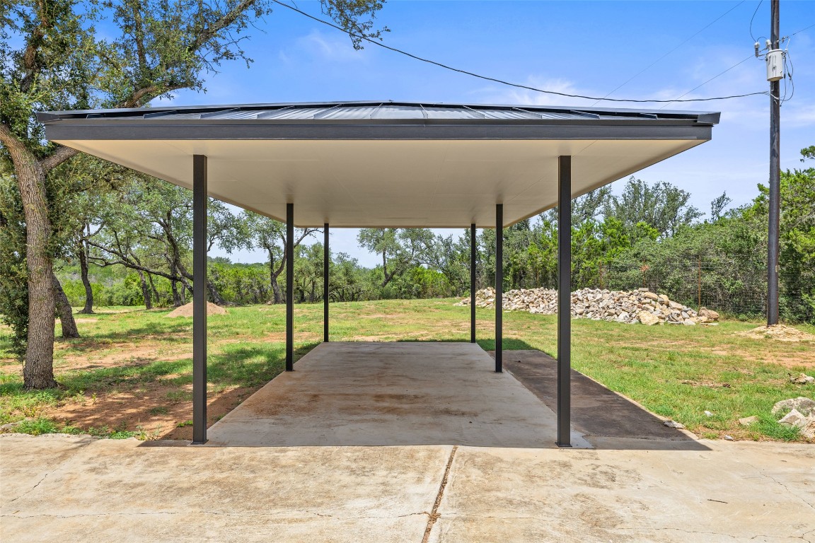 11151 Highway 71 Spicewood, TX 78669 - Photo 35 of 40 Unit C – Exclusive detached carport located at the end of the shared driveway behind a private security gate.