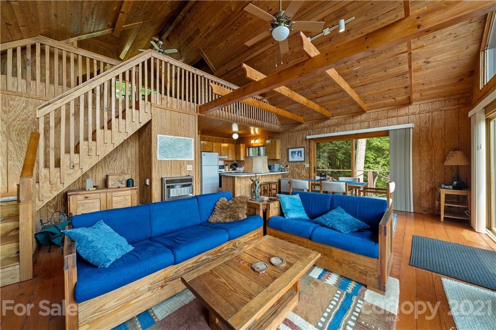 171 Jade Drive Clyde, NC 28721 - Photo 11 of 30 a living room with furniture wooden floor and a large window