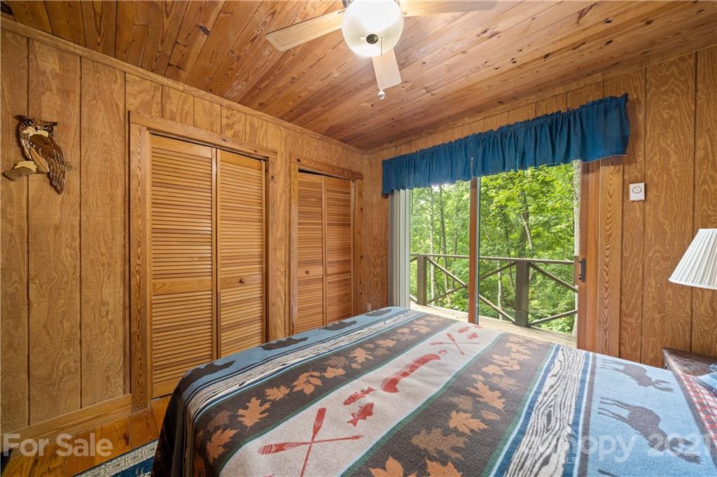 171 Jade Drive Clyde, NC 28721 - Photo 18 of 30 a bedroom with a bed and a window