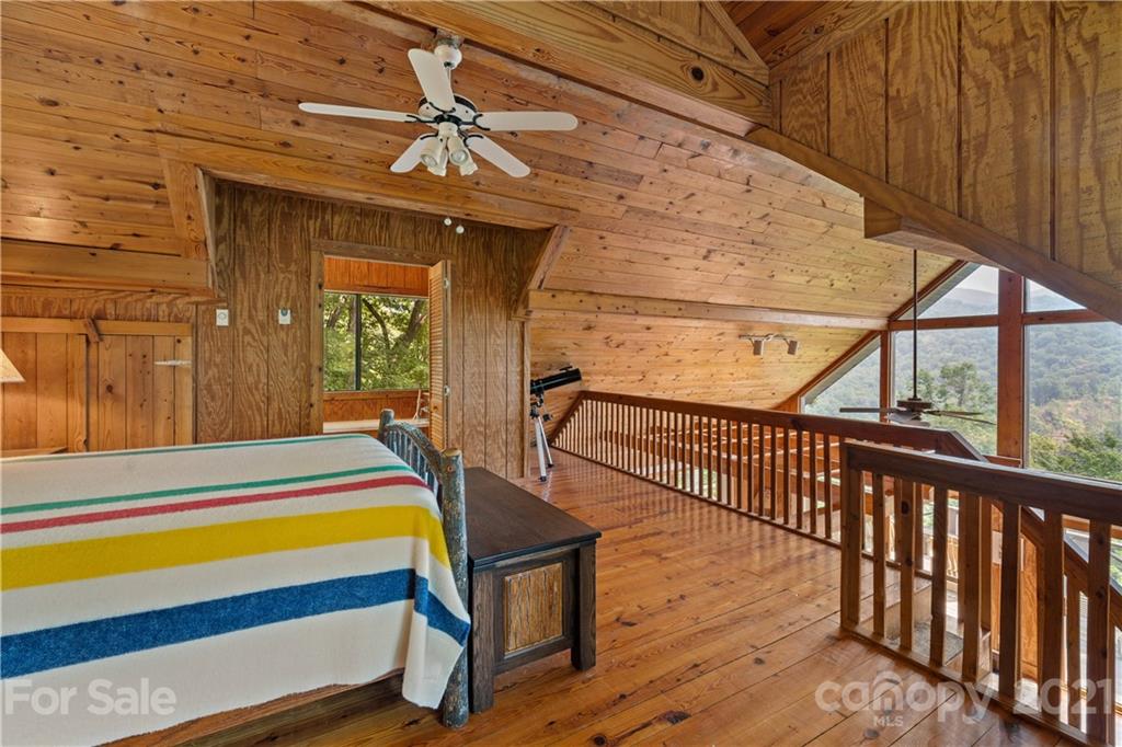 171 Jade Drive Clyde, NC 28721 - Photo 21 of 30 a room with wooden floor pool table and windows