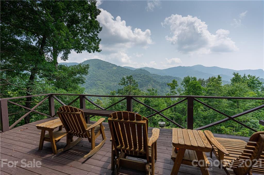 171 Jade Drive Clyde, NC 28721 - Photo 23 of 30 a view of a roof deck with wooden floor and outdoor seating
