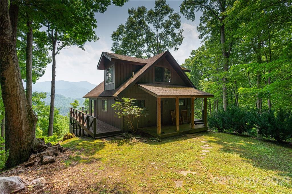 171 Jade Drive Clyde, NC 28721 - Photo 24 of 30 a front view of a house with a yard