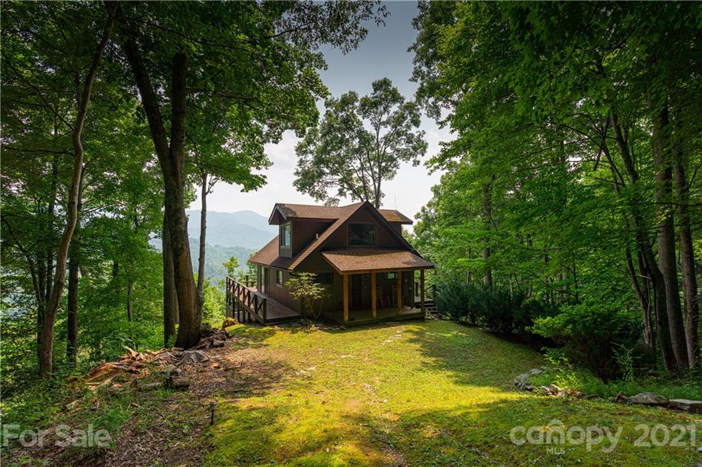 171 Jade Drive Clyde, NC 28721 - Photo 26 of 30 a front view of a house with garden