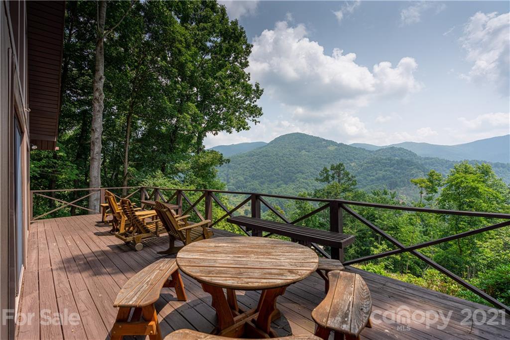 171 Jade Drive Clyde, NC 28721 - Photo 4 of 30 a view of a chairs and table in patio