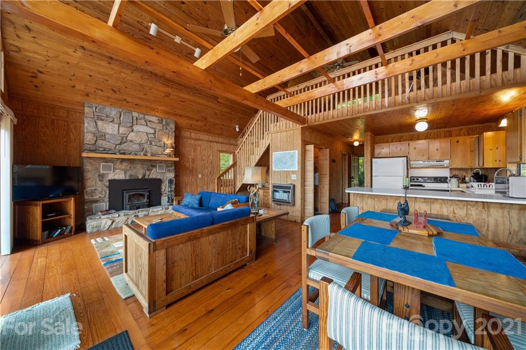 171 Jade Drive Clyde, NC 28721 - Photo 9 of 30 a view of a kitchen with furniture and a fireplace