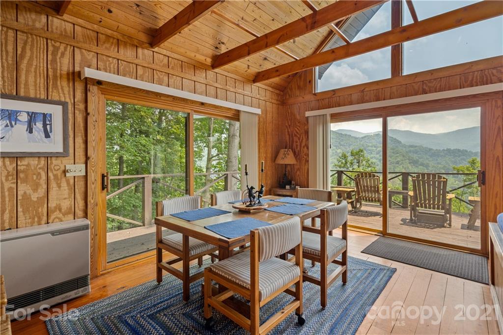 171 Jade Drive Clyde, NC 28721 - Photo 10 of 30 a dining room with wooden floor and furniture