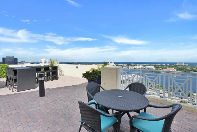 a view of a chairs and table in patio