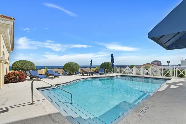 a view of a swimming pool from a balcony